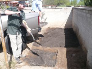 Integrating good soil into the dirt with shovels