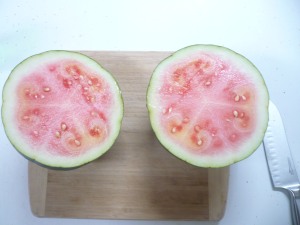 Watermelon cut in half, not quite ripe