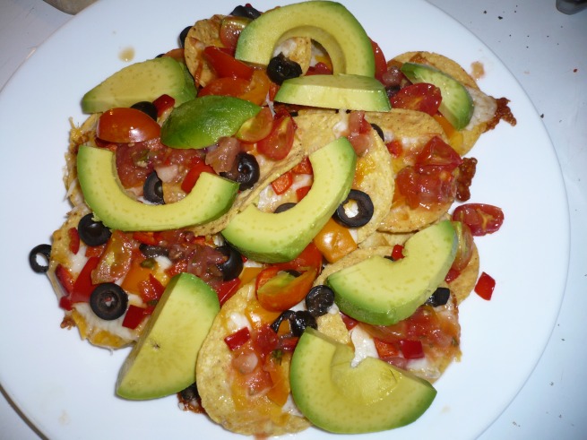 Nachos with peppers, olives, and avocado