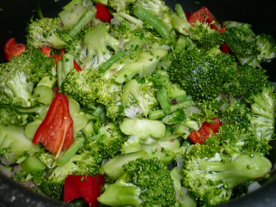 Sauteing beans, broccoli and peppers