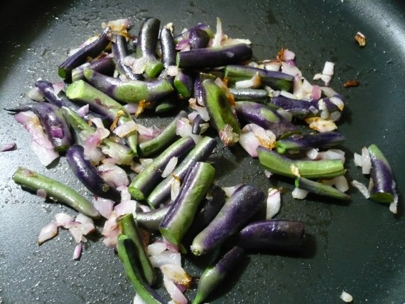 Purple beans sauteed with onions