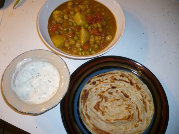 Curry with raita and paratha